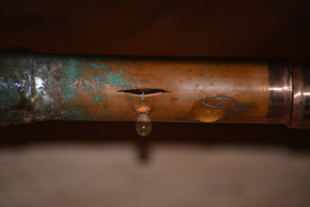Burst pipe with water dripping